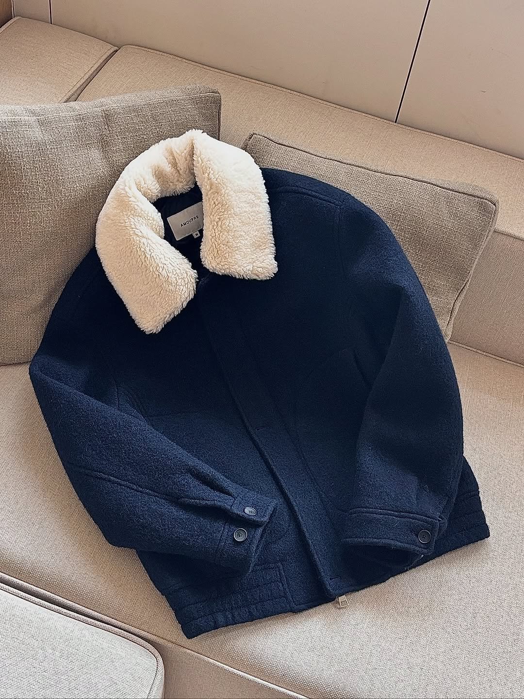 Photo by AMOUPRE 아모프레 on October 20, 2025. May be an image of blanket, knit, fur, sweater, fleece, bath robe, cardigan and text.