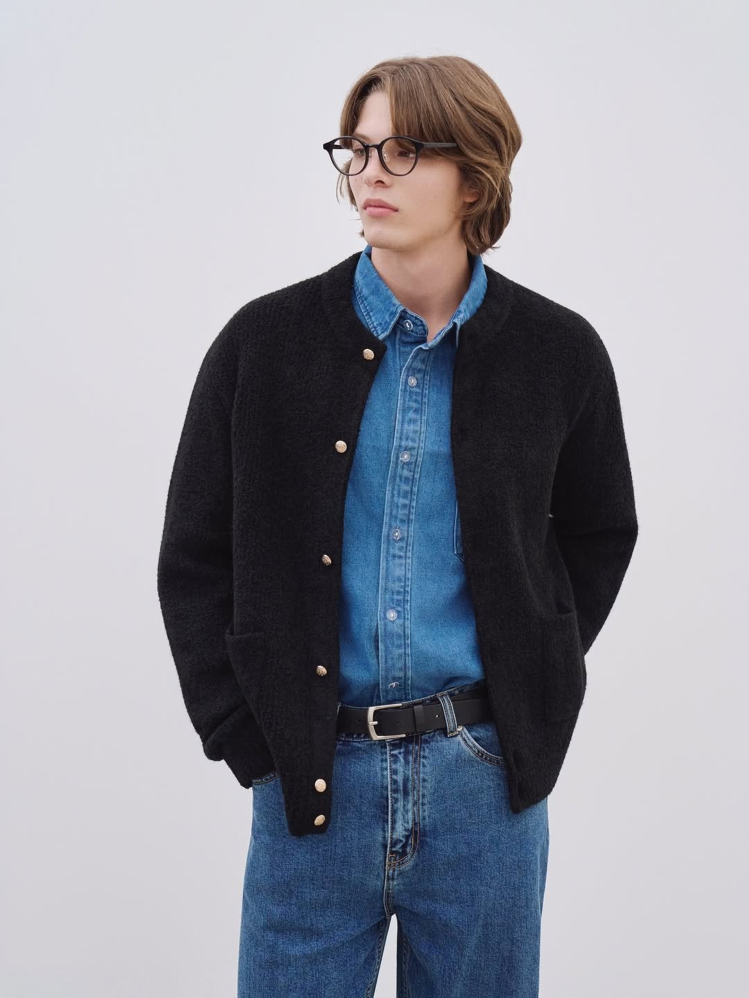 Photo by AMOUPRE 아모프레 on November 10, 2025. May be an image of one or more people, eyeglasses, sweater, outerwear and text.