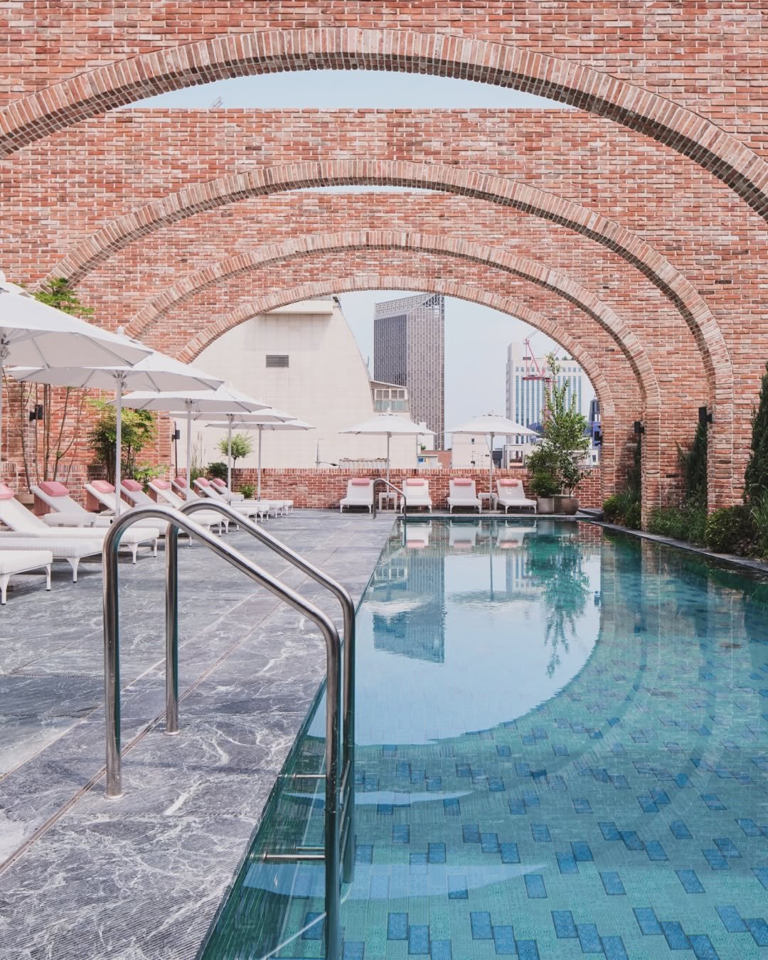 ananti.hotels 게시물 이미지: Beyond the arches,
two pools with distinct...