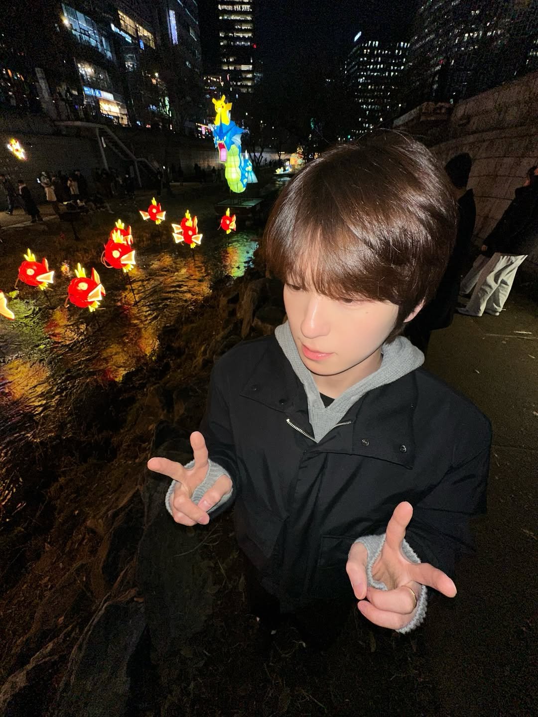 Photo by 안찬혁 on December 26, 2025. May be an image of duffle coat, night and text.