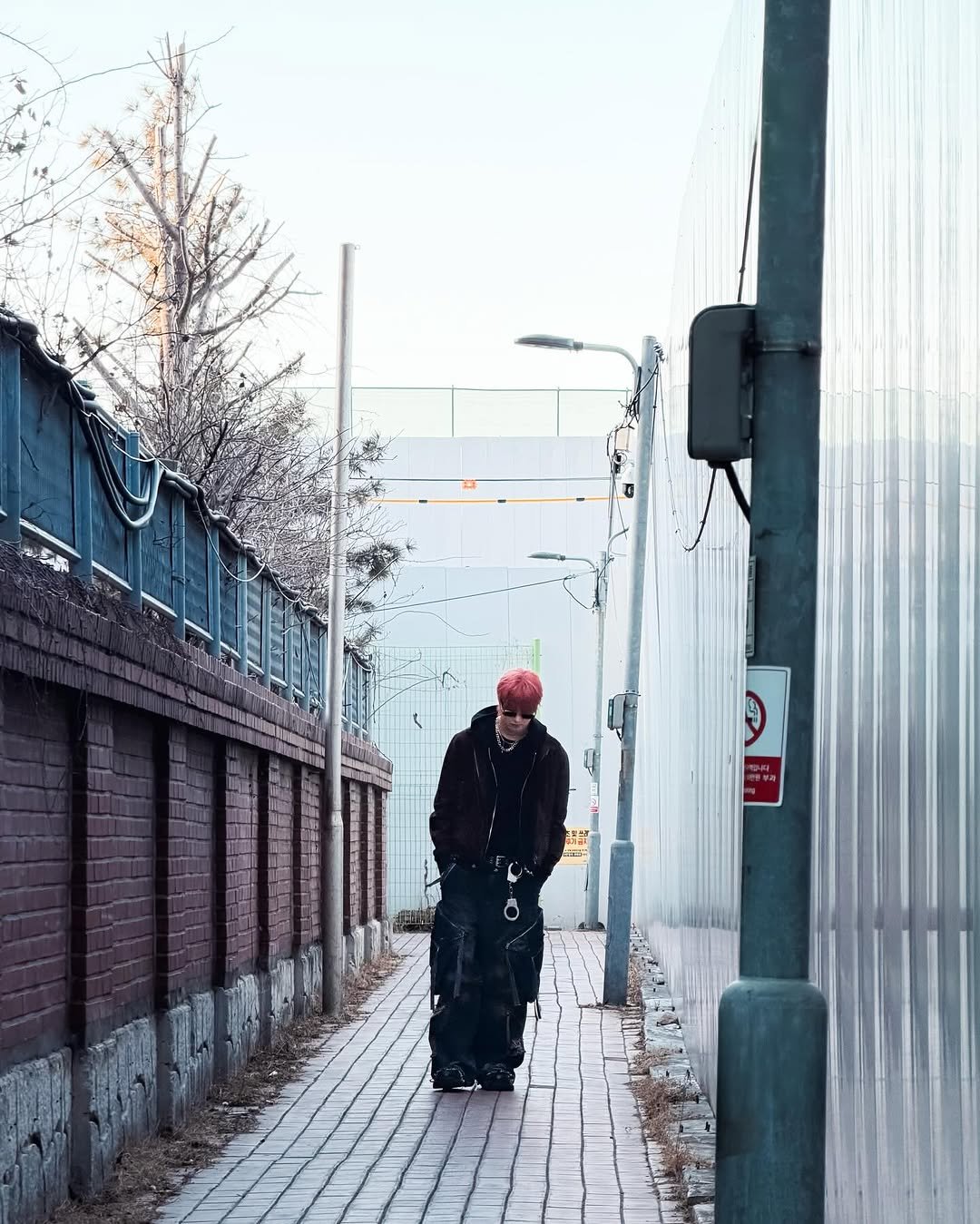 Photo by &TEAM on March 28, 2026. May be an image of standing, street, curb and text.