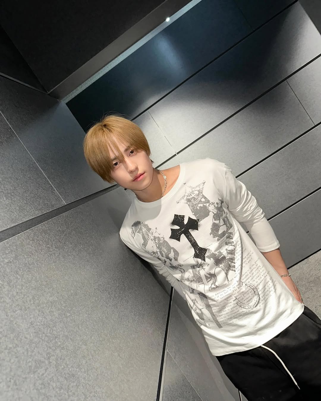 Photo by &TEAM on March 29, 2026. May be an image of one or more people, blonde hair, top, bolo tie and text.