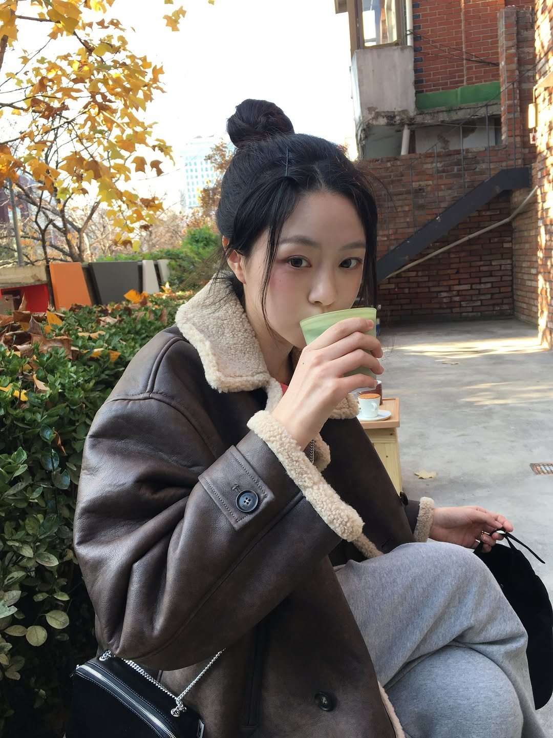 Photo shared by 안은빈 | Eunbin Ahn on December 05, 2025 tagging @oic.oioicollection, and @vaseline_korea. May be an image of duffle coat, overcoat, parka, jacket, cornflower and text.