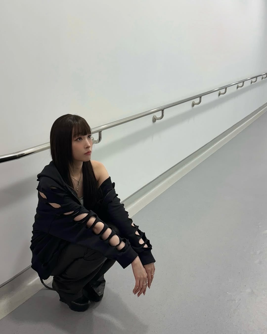 Photo by ANNIE on March 25, 2026. May be an image of turtleneck, sweatpants, costume and text.