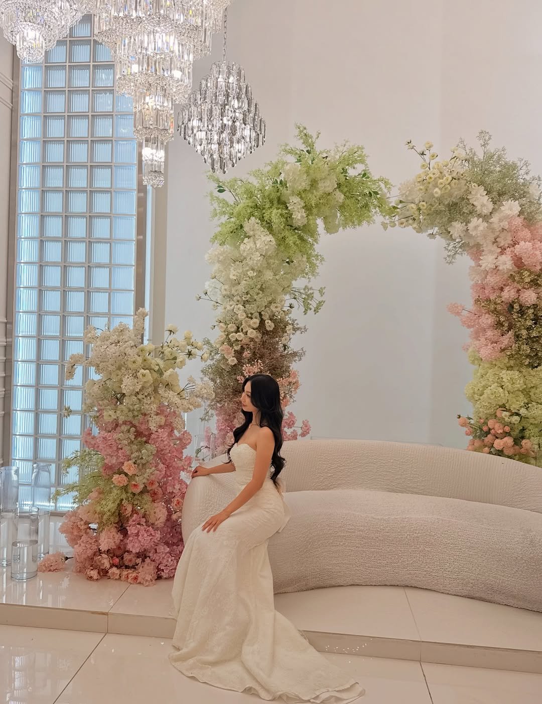 Photo shared by Anu Ujin on December 17, 2025 tagging @anyang_city, @ay_aba248, and @superinfluencerawards_official. May be an image of candle holder, flower arrangement, chandelier, gown, wedding, dais and text.
