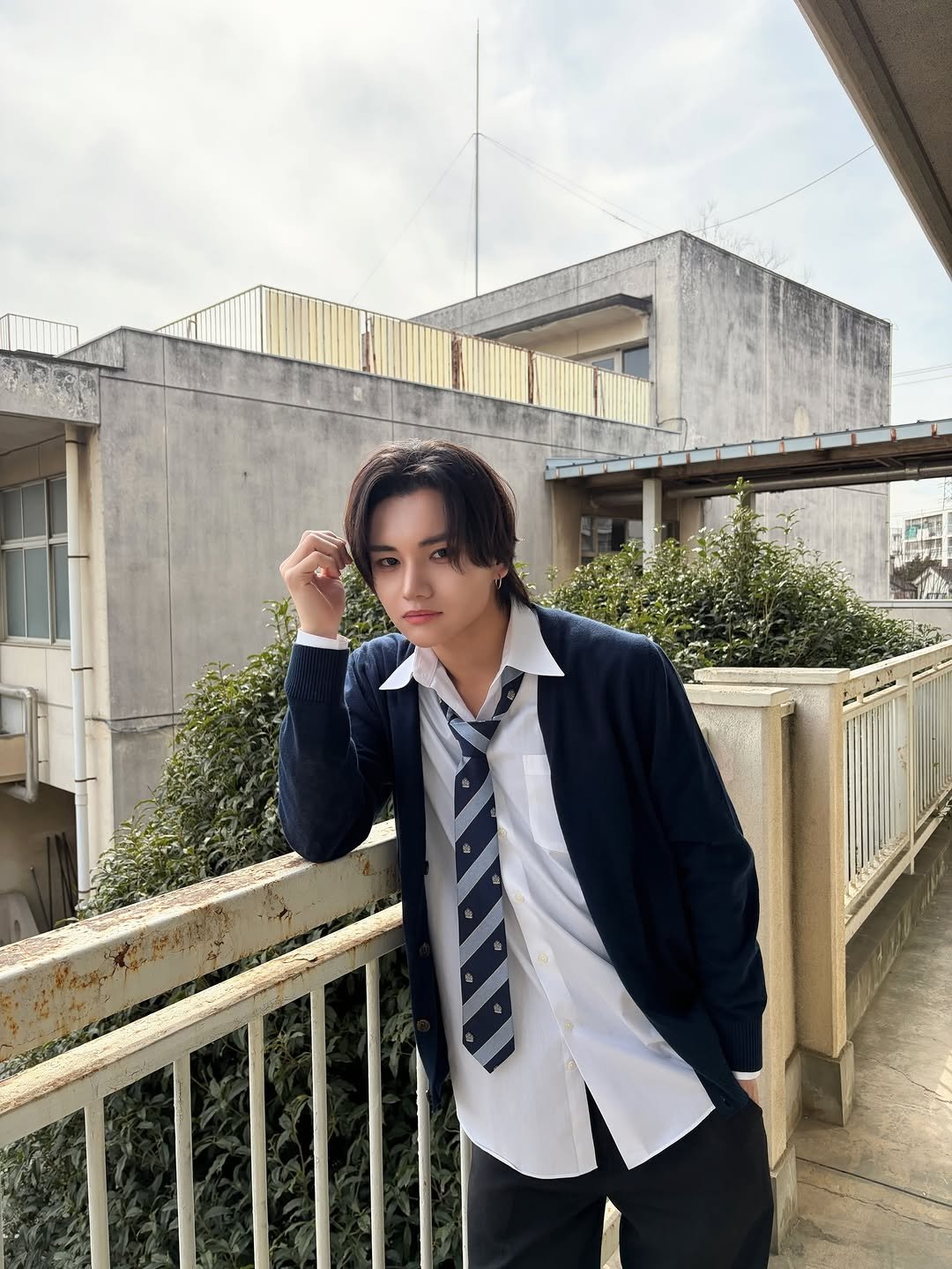 Photo by aoen on March 17, 2026. May be an image of one or more people, hair, duffle coat, suit, blazer, bolo tie and text.