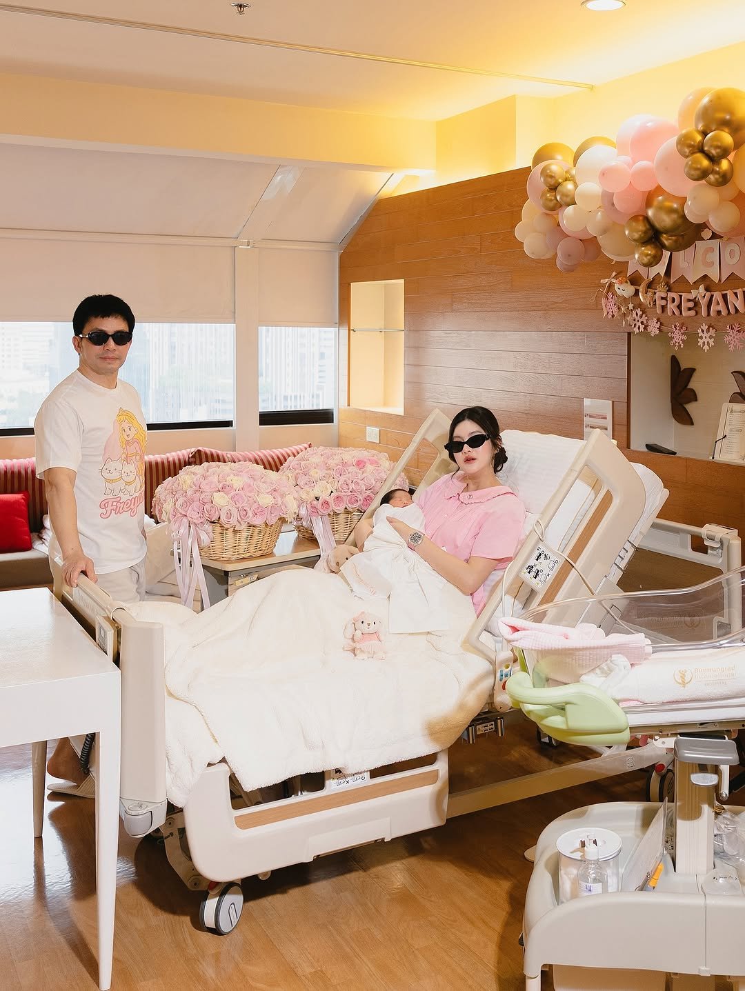 Photo shared by Somrutai Rattanawaraha on November 15, 2025 tagging @dr_nopparat, and @freya.freyana. May be an image of balloon, diaper, baby bed, hospital, dais and text.