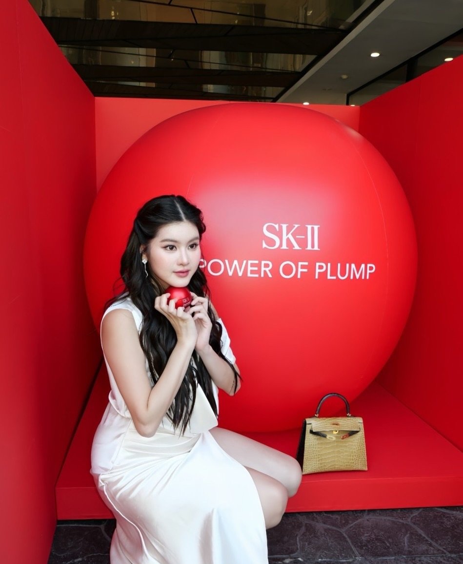 Photo by Somrutai Rattanawaraha on January 14, 2026. May be an image of one or more people, makeup, lipstick, hair and text that says 'SK-II POWEROFPLUMP POWER OF PLUMP'.