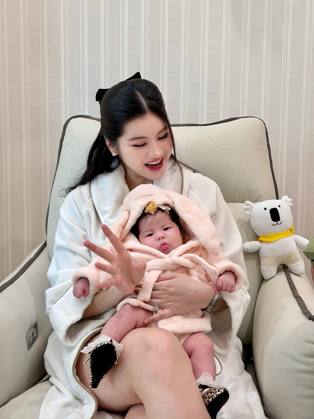 Photo shared by Somrutai Rattanawaraha on January 09, 2026 tagging @freya.freyana. May be an image of baby, sleepwear, robe, bath robe, diaper and text.