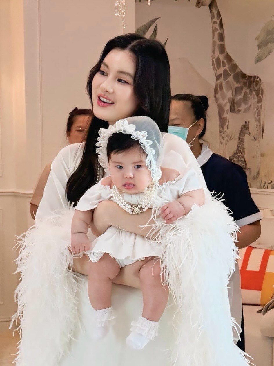 Photo by Somrutai Rattanawaraha on March 01, 2026. May be an image of baby, hair, dress and text.