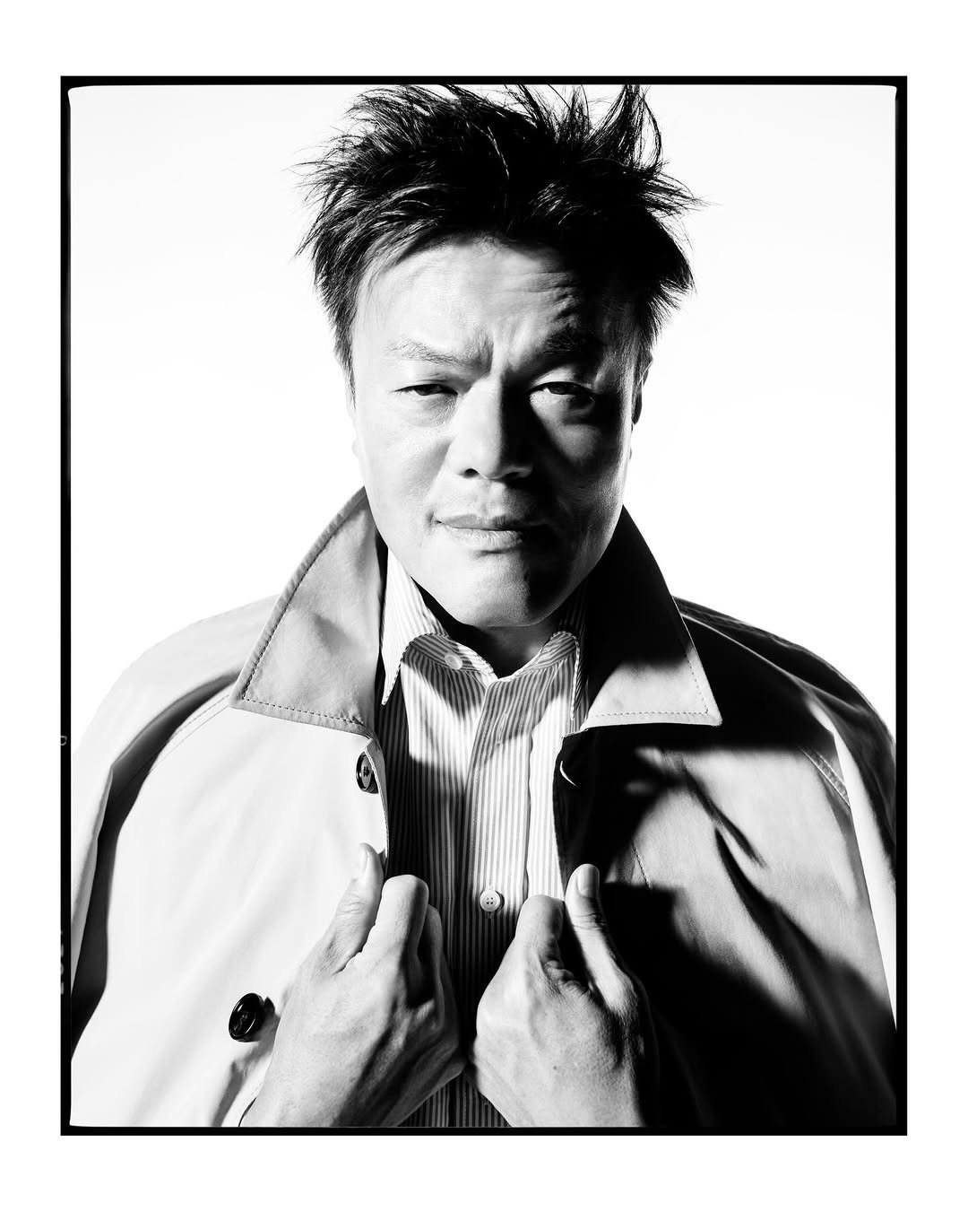 Photo shared by Burberry on March 11, 2026 tagging @timwalker, @burberry, and @asiansoul_jyp. May be a black-and-white image of overcoat, cigarette, poster, magazine and text.