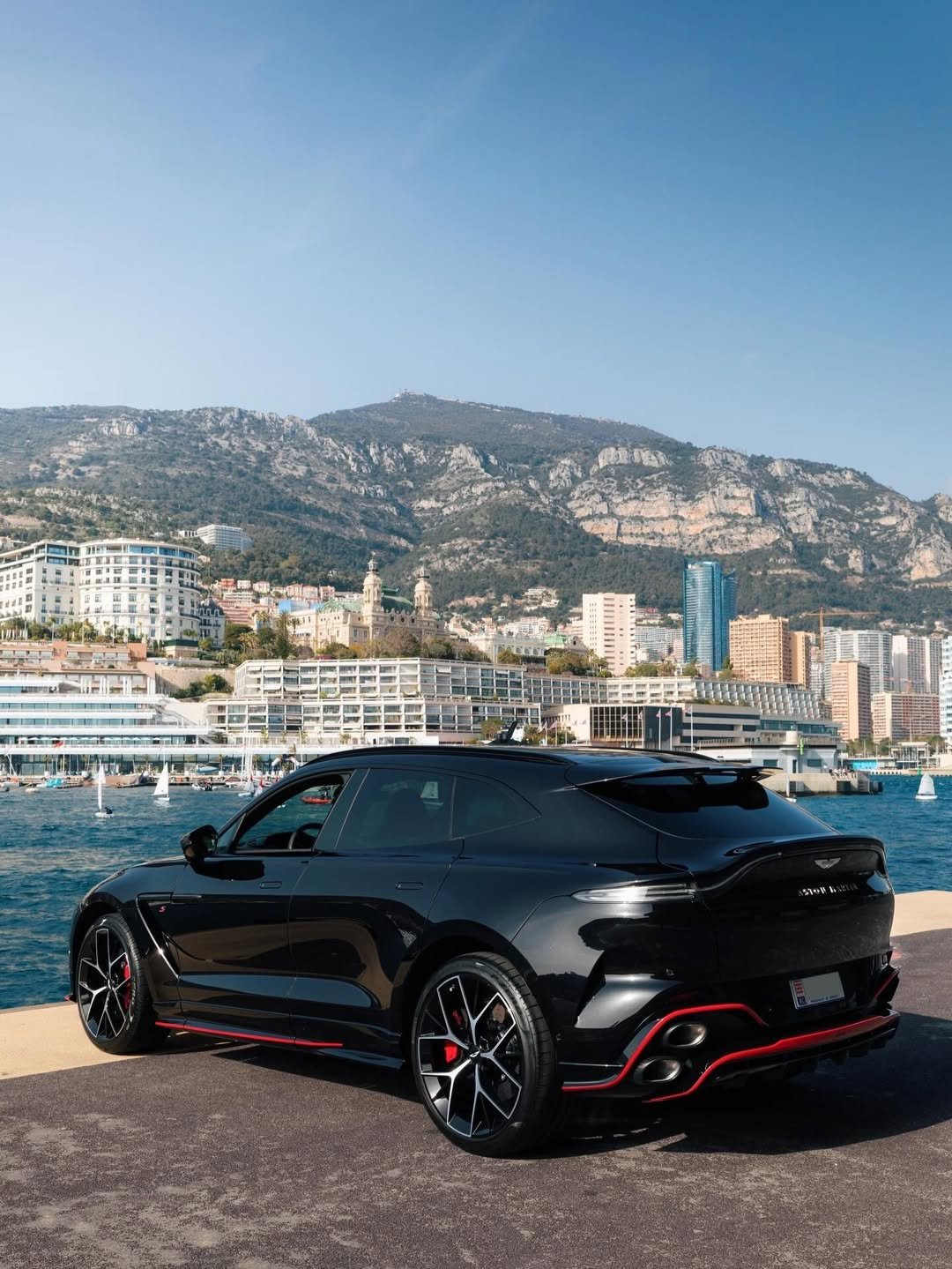 Photo by Aston Martin on April 24, 2026. May be an image of car, wheel, road and text.