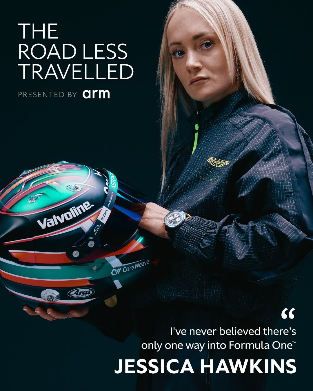 Photo shared by Aston Martin Aramco Formula One™ Team on April 25, 2026 tagging @arm, and @1jessicahawkins. May be an image of racing vehicles, poster, helmet, sports equipment, magazine, glasses and text that says 'THE ROAD ROADLESS LESS TRAVELLED PRESENTEDBY arm ٢ ASTON Valvoline Hй. GRENONIO GLINSS CW Core CoreWea Ara " I've never believed there's only one way into Formula One™ JESSICA HAWKINS'.