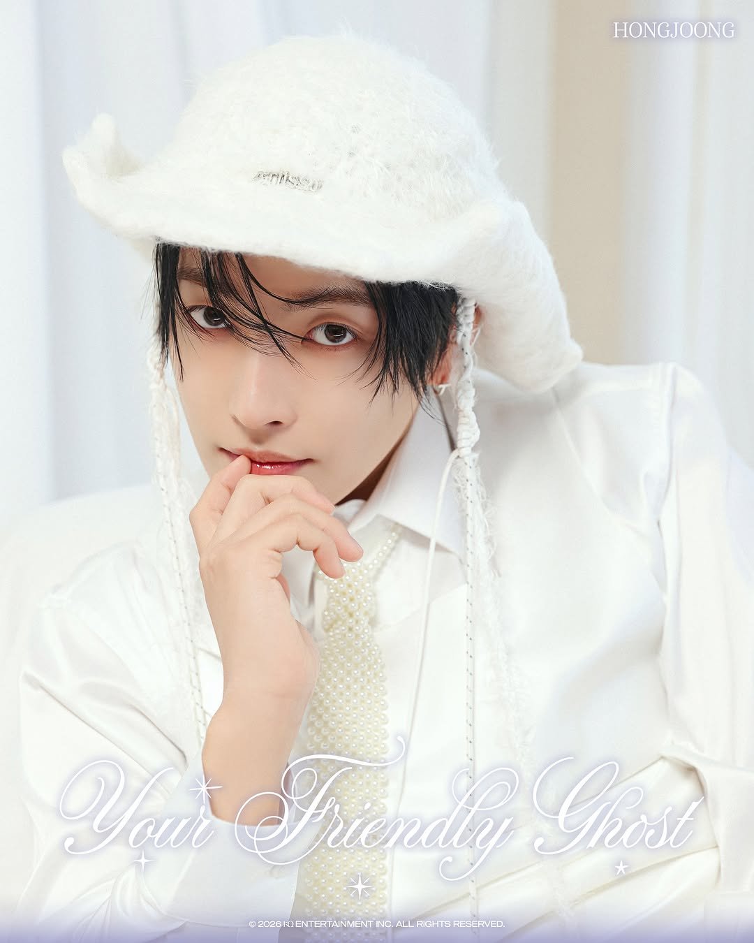 Photo by ATEEZ(에이티즈) on April 25, 2026. May be an image of bolo tie, magazine and text.