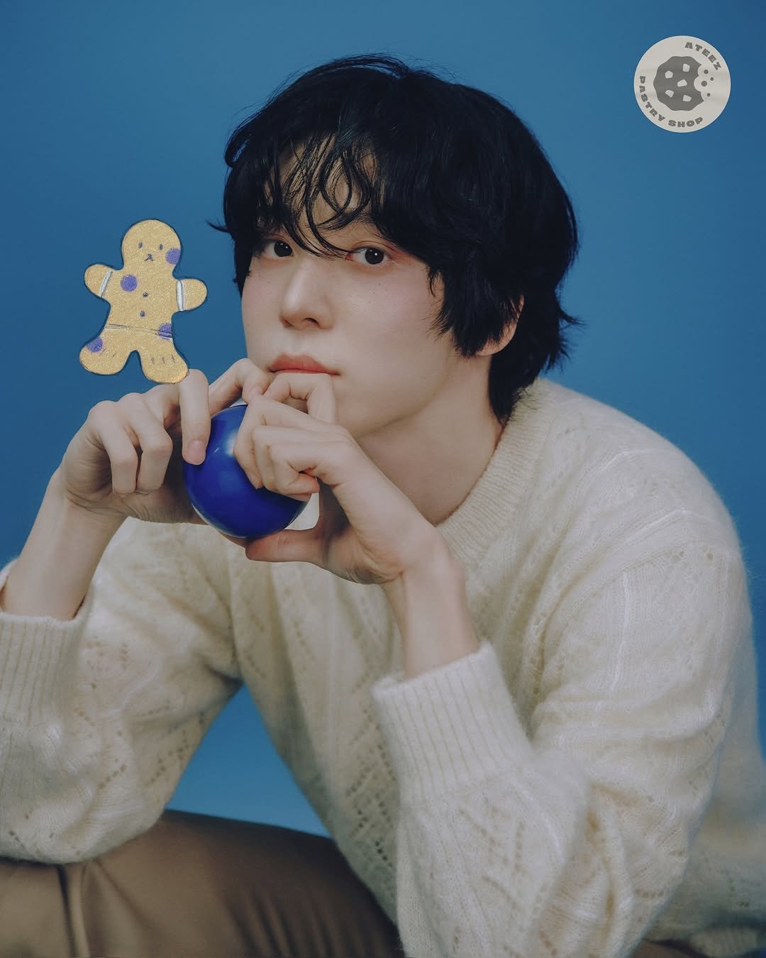 Photo shared by ATEEZ(에이티즈) on November 30, 2025 tagging @yunou._.u. May be an image of gingerbread cookie, magazine and text.