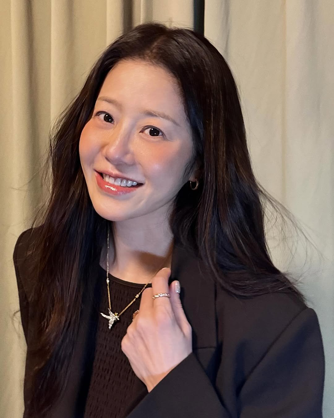 Photo by 고현정 on September 23, 2025. May be an image of 1 person, makeup, suit, blazer and text.