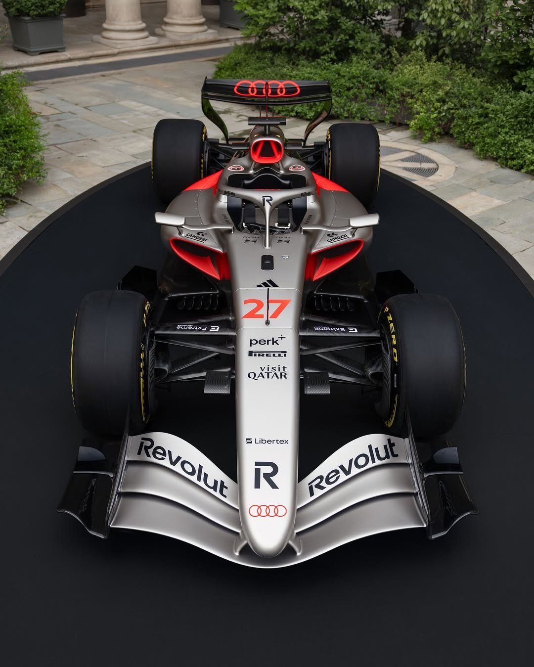 Photo shared by Audi on April 20, 2026 tagging @audif1. May be an image of racing vehicles, race car and text.