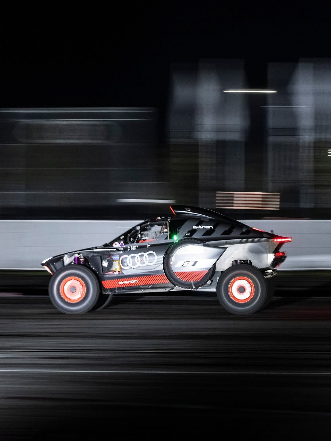 Photo shared by Audi Sport on November 25, 2025 tagging @dakarrally, @auditradition, and @qmotorsport.official. May be an image of racing vehicles, buggy, race car and text.