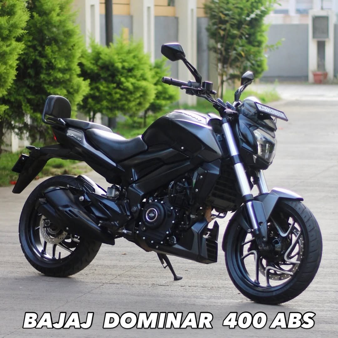 Photo by Autologymotors on November 28, 2025. May be an image of scooter, motorcycle, wheel and text that says 'BAJAJ DOMINAR 400ABS 400 ABS'.