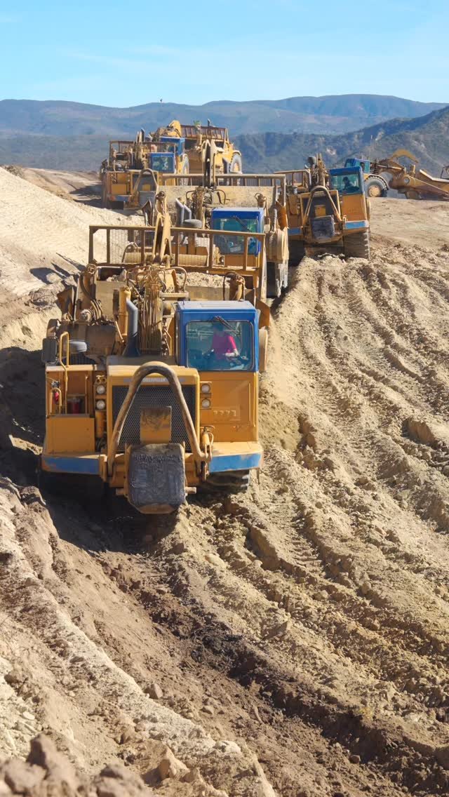 awesome_earthmovers 게시물 이미지: A flood of scrapers coming over a ridge in...