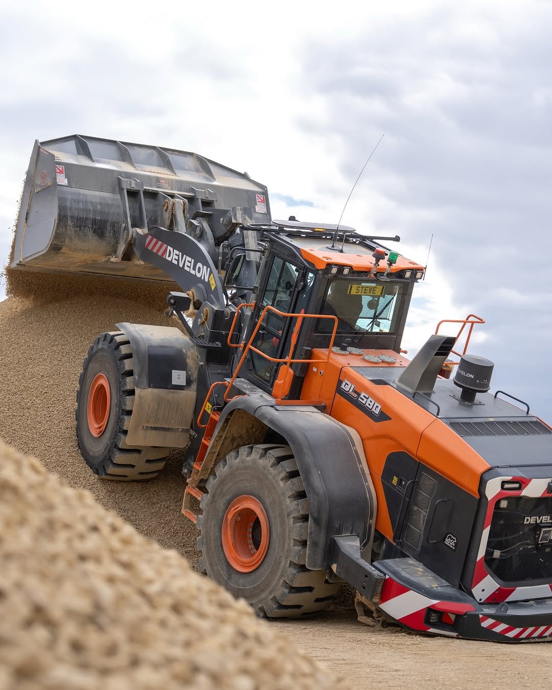 Photo shared by Awesome Earthmovers on February 16, 2026 tagging @powerscreen, @bluemachinerygroup, and @develon_europe. May be an image of tractor and text.