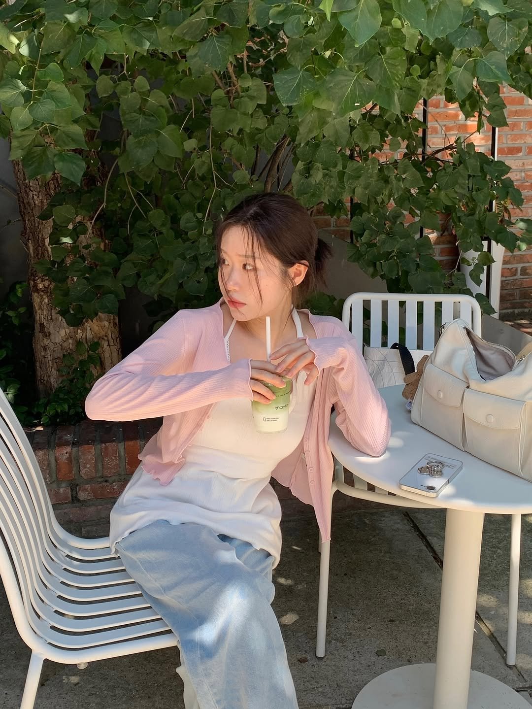 Photo by 영아 on August 12, 2025. May be an image of 1 person, drink and cornflower.