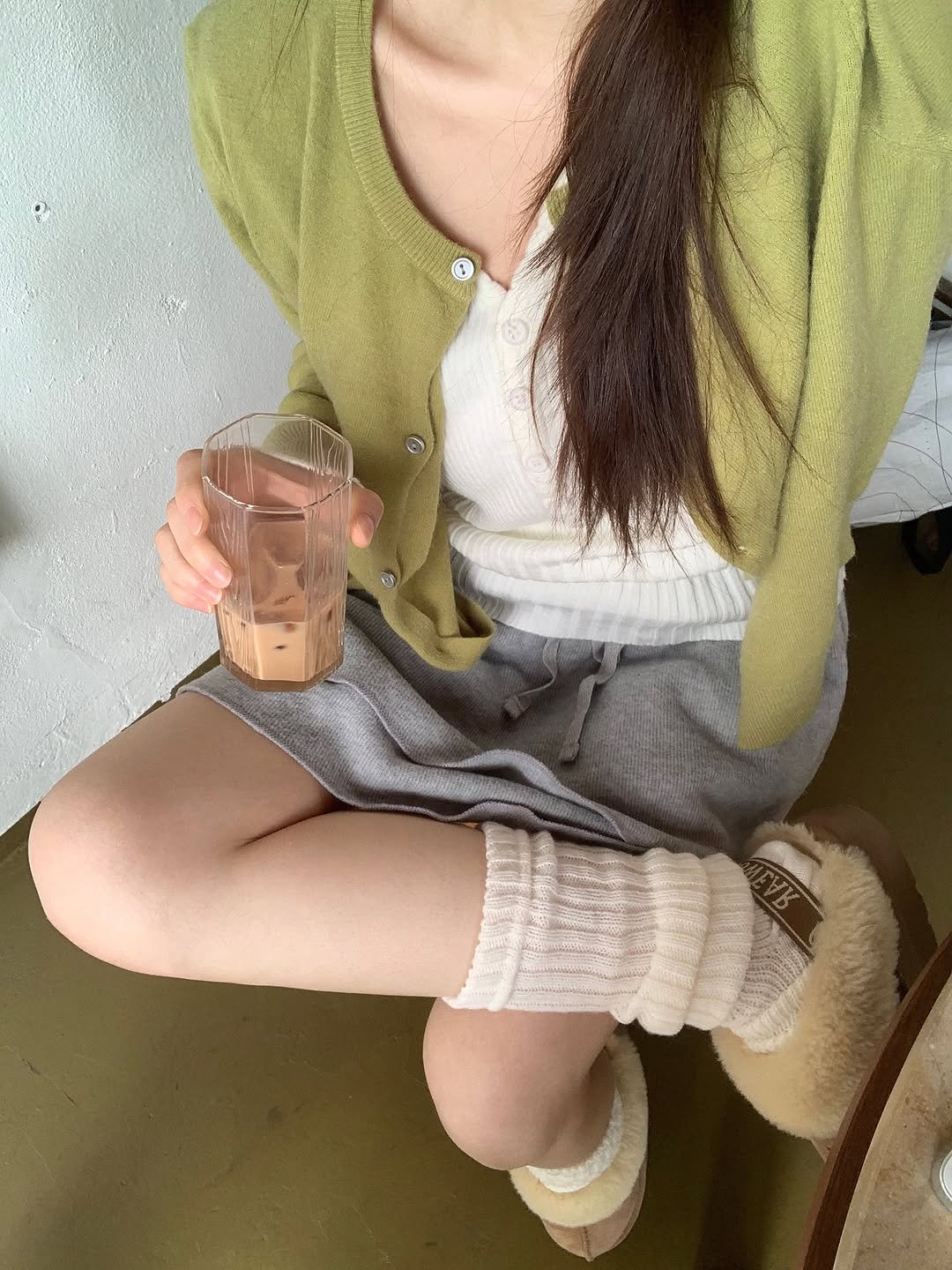 Photo by 영아 on November 01, 2025. May be an image of sleepwear, sweater, sock, bath robe and text.