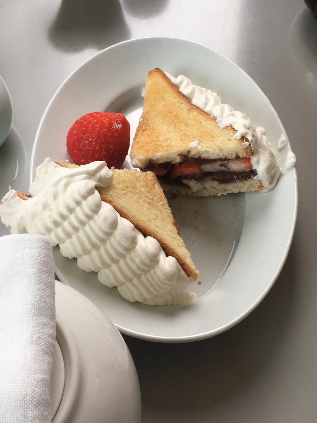 Photo by 영아 on December 17, 2025. May be an image of chiffon cake, strawberry, cheesecake, whipped cream, sandwich and text.