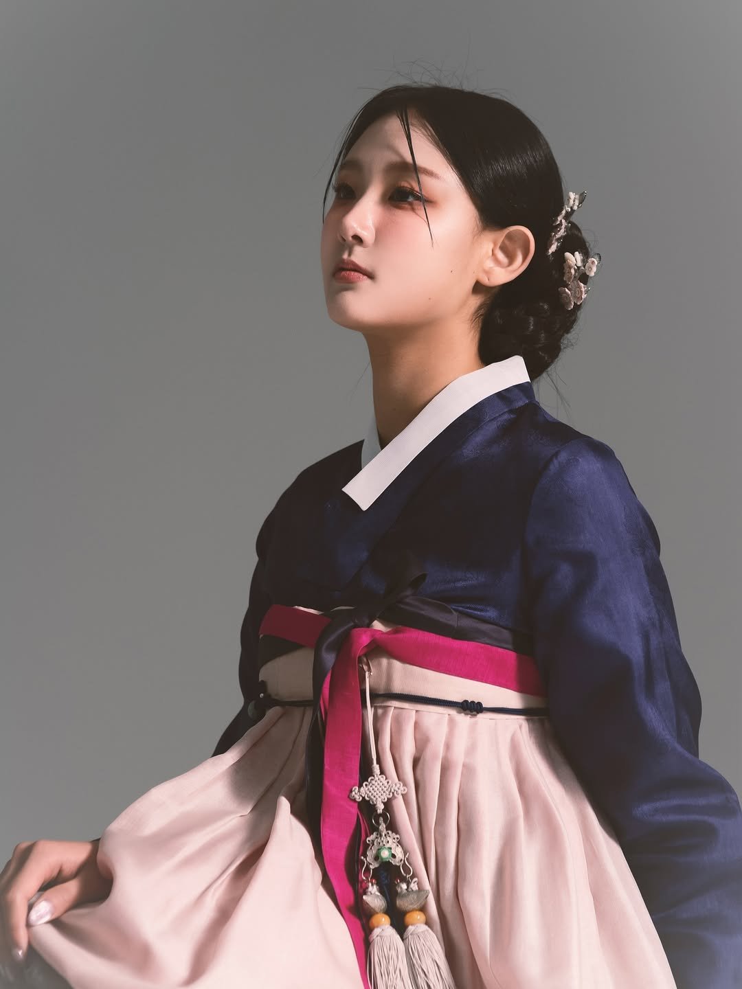 Photo by 고경 on February 15, 2026. May be an image of one or more people, makeup and text.