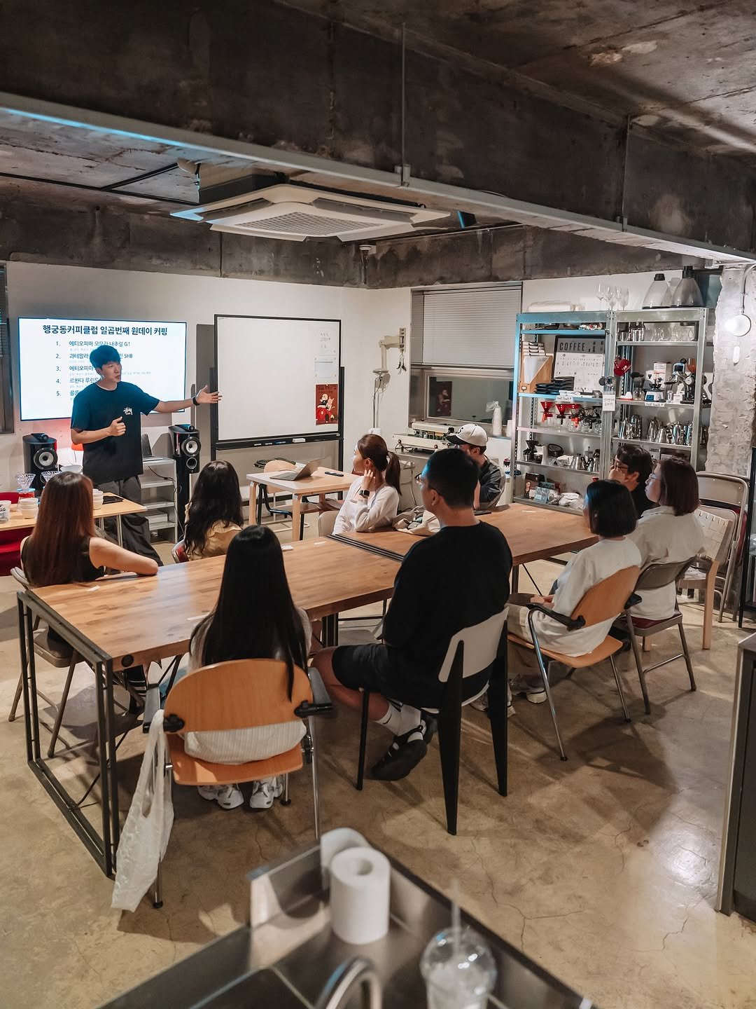 Photo shared by 빈백 | CHANG SU, OH on August 12, 2025 tagging @jungjiyoungcoffee, @_h.pic_, and @cafe.spaceshop. May be an image of 6 people, people studying, table, bureau, office and text.