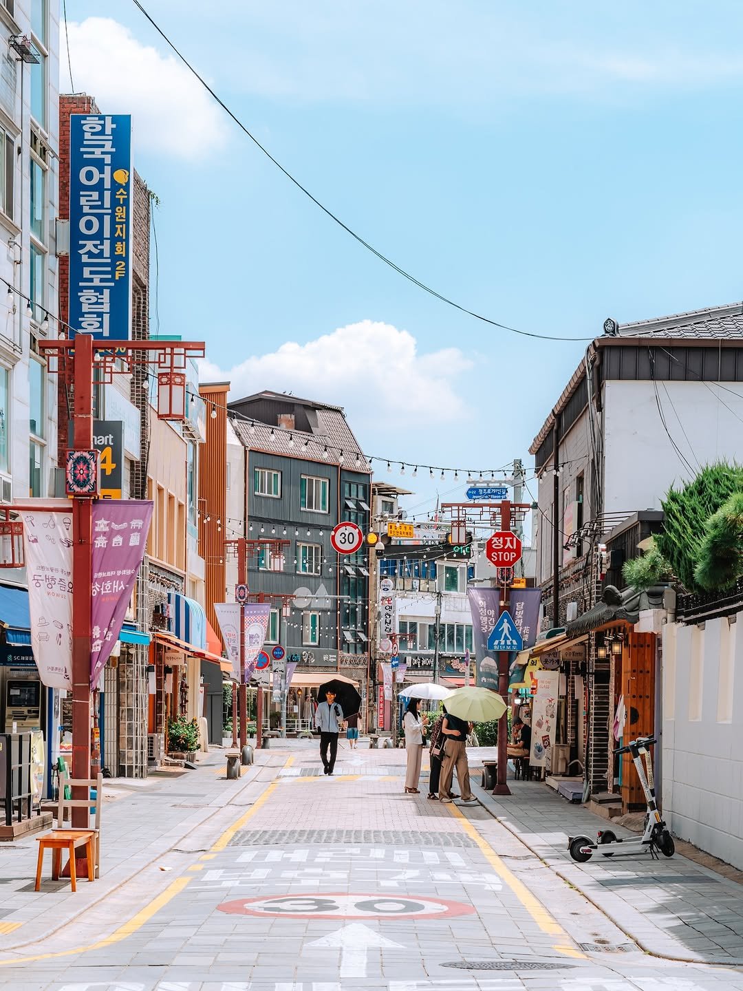 Photo shared by 빈백 | CHANG SU, OH on September 03, 2025 tagging @suwon_city. May be an image of 2 people, street, telephone pole, lamppost and text.