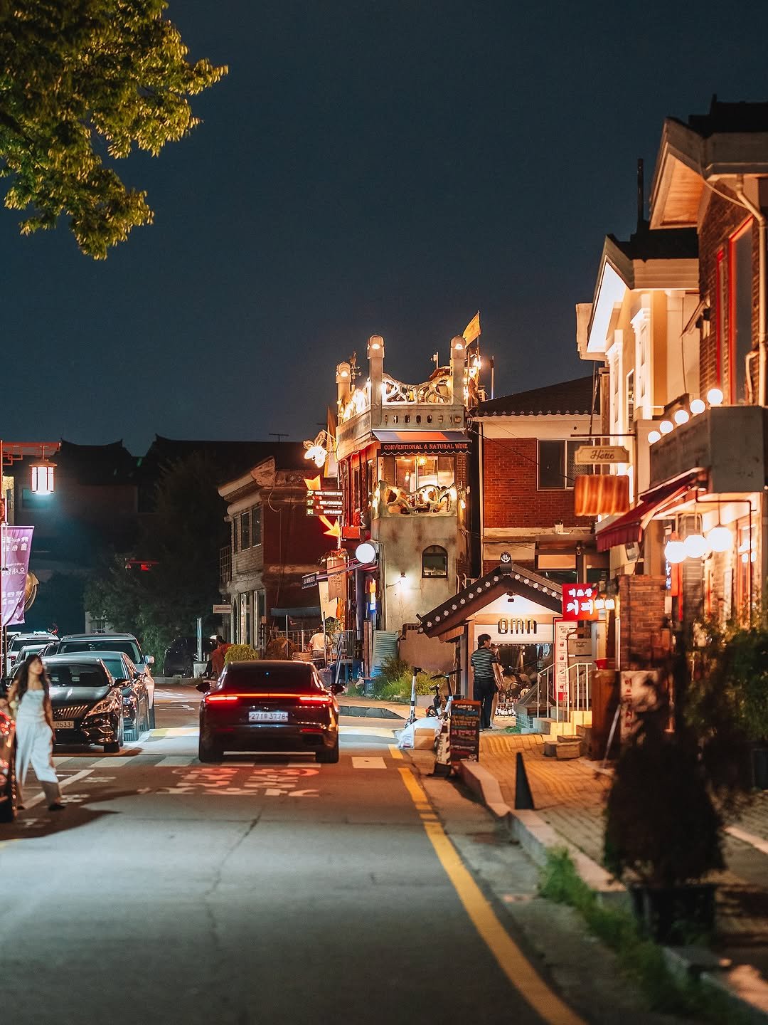 Photo shared by 빈백 | CHANG SU, OH on August 11, 2025 tagging @trazy_korea, @sonykorea, @suwon_city, @sonyalpha, @gyeonggi_tour, @gyeonggi__official, and @visitkorea_travel. May be an image of 3 people, lantern, street, temple, night and text.