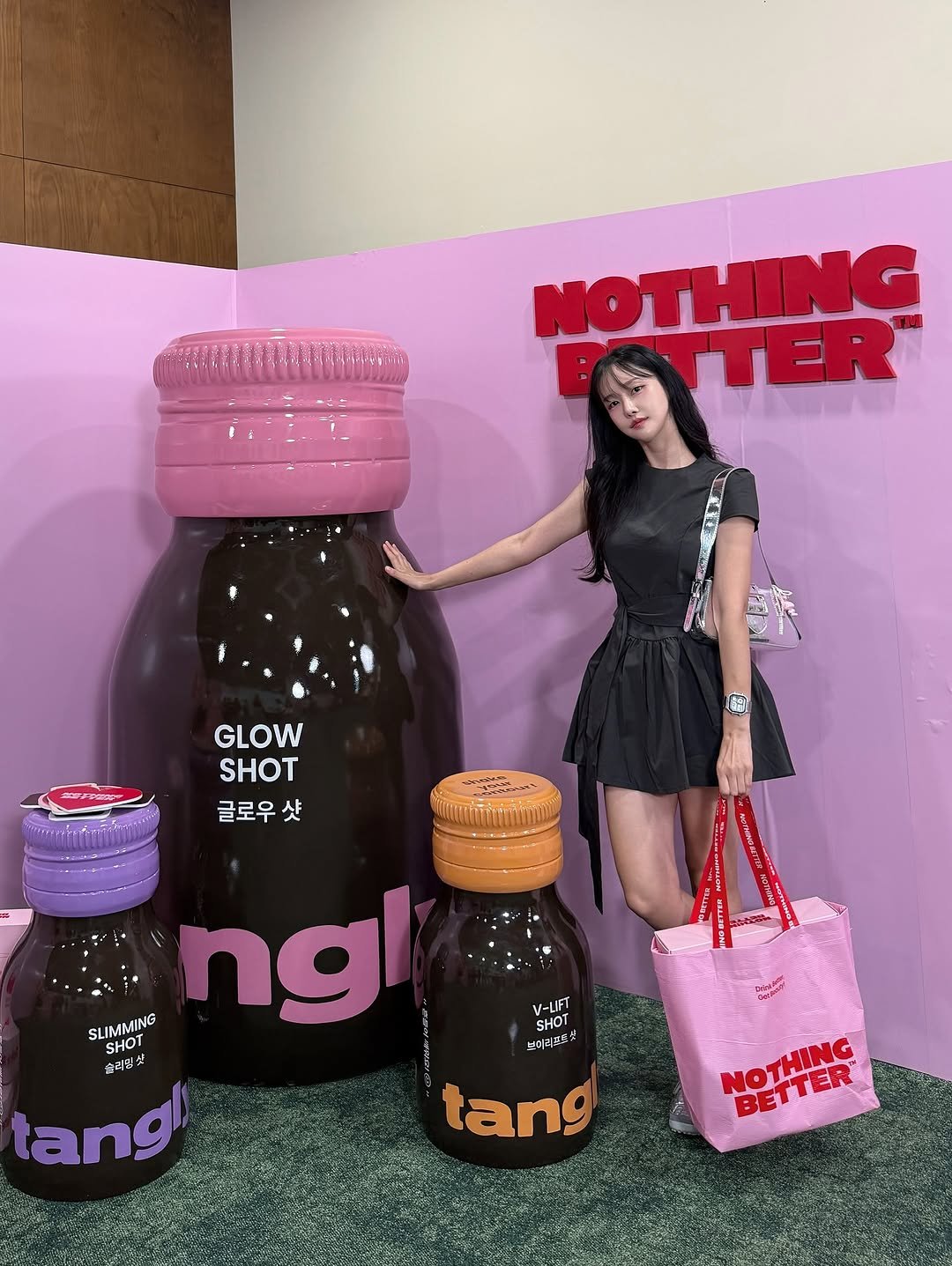 Photo shared by 변민서 on September 07, 2025 tagging @nothingbetter.official, and @tangly_official. May be an image of 1 person, medicine, juice, condiment, bottle and text that says 'NOTHING OTTER ATTER GLOW SHOT 글로우 샷 SLIMMING ngl SHOT 슬리빛맛 快生 슬리핀 tang SHOT V-LIFT 브미리즈샷 tang NOTHING BETTER'.