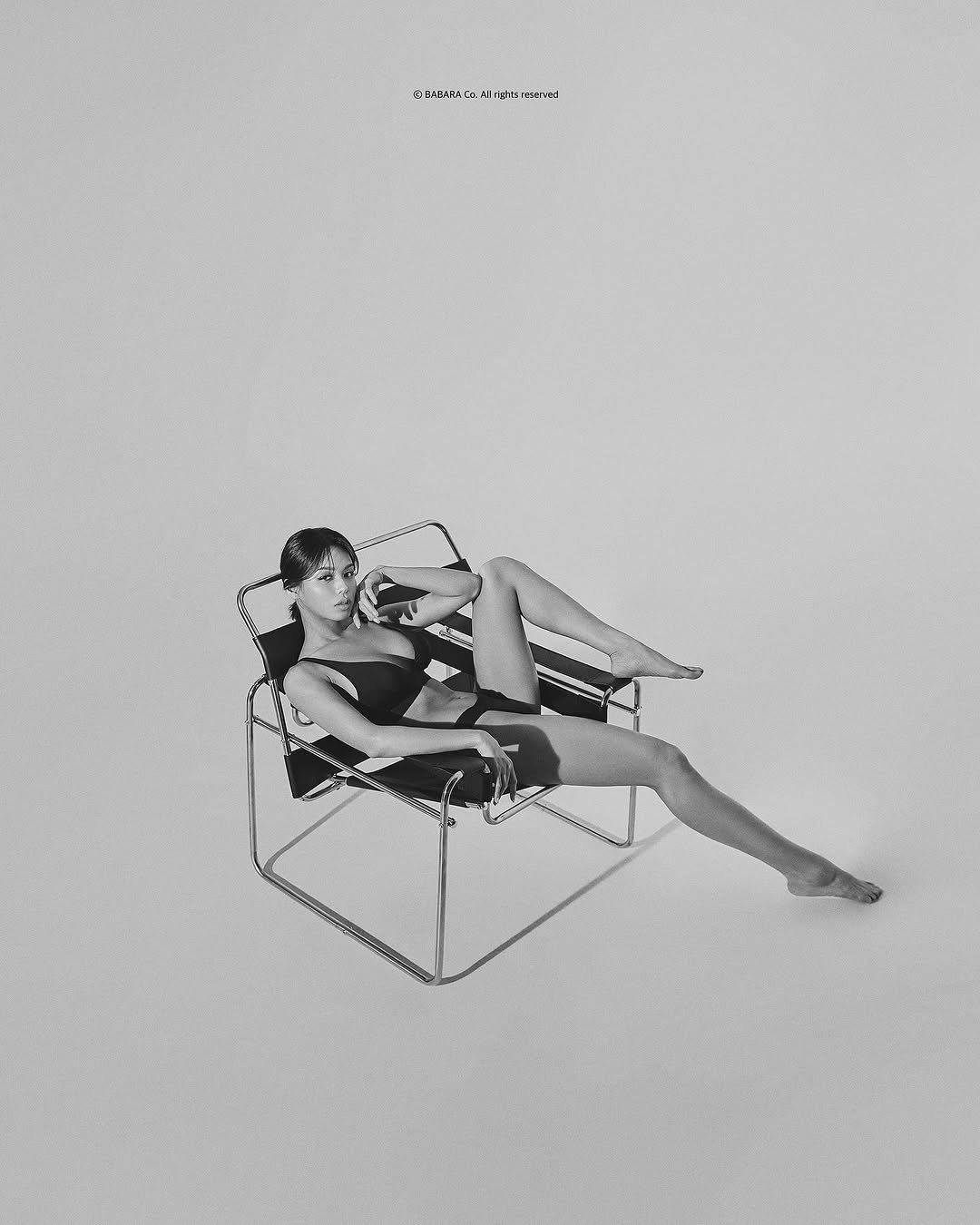Photo by 바바라스튜디오 공식 인스타그램 on August 29, 2025. May be an illustration of 1 person, rocking chair, deck chair, chair, cigarette, chaise lounge and text.