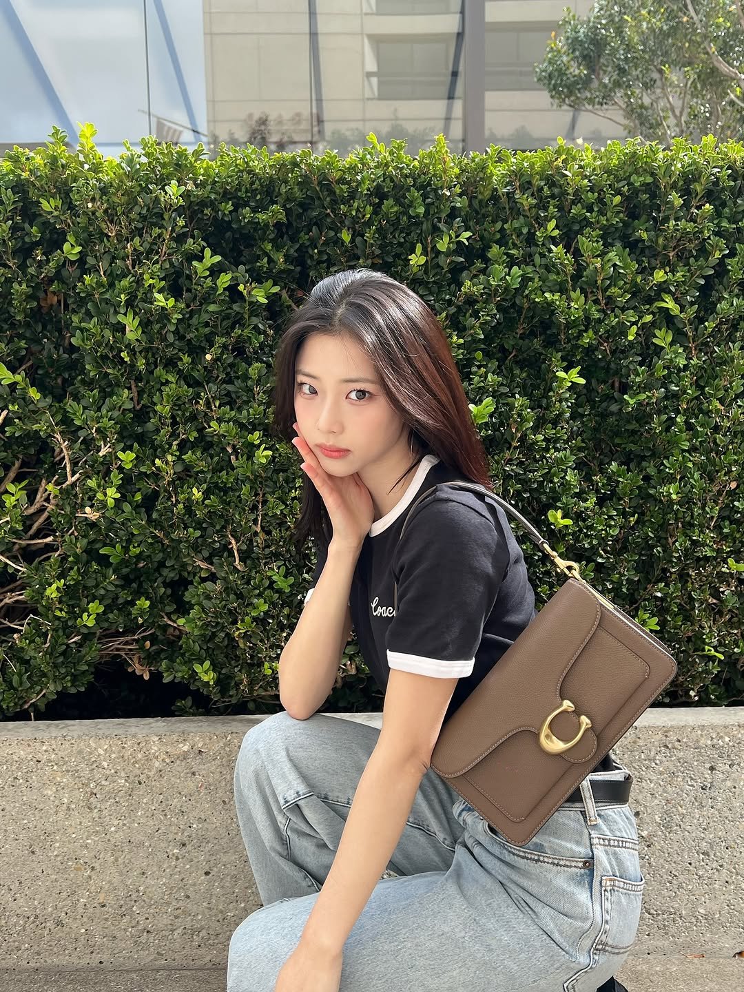 Photo by BABYMONSTER (베이비몬스터) on September 26, 2025. May be an image of 1 person, purse and text.