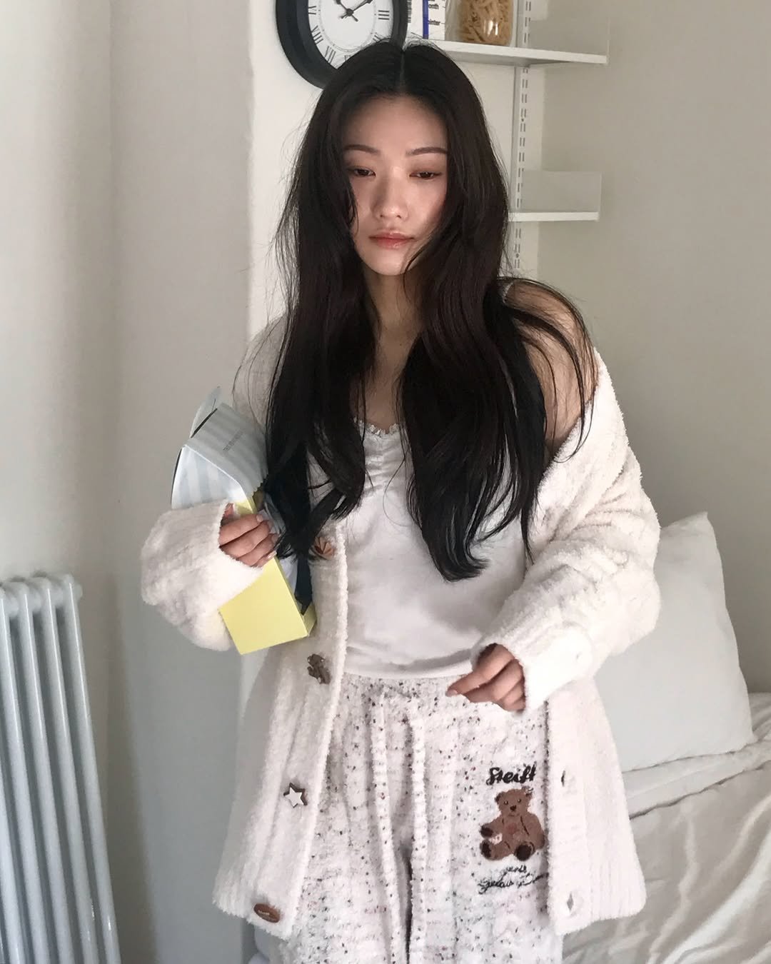 Photo shared by 🪞윤경 | 패션모델 on December 18, 2025 tagging @gelatopique_korea. May be an image of one or more people, hair, sleepwear, bath robe, top, cardigan, sweater and text.