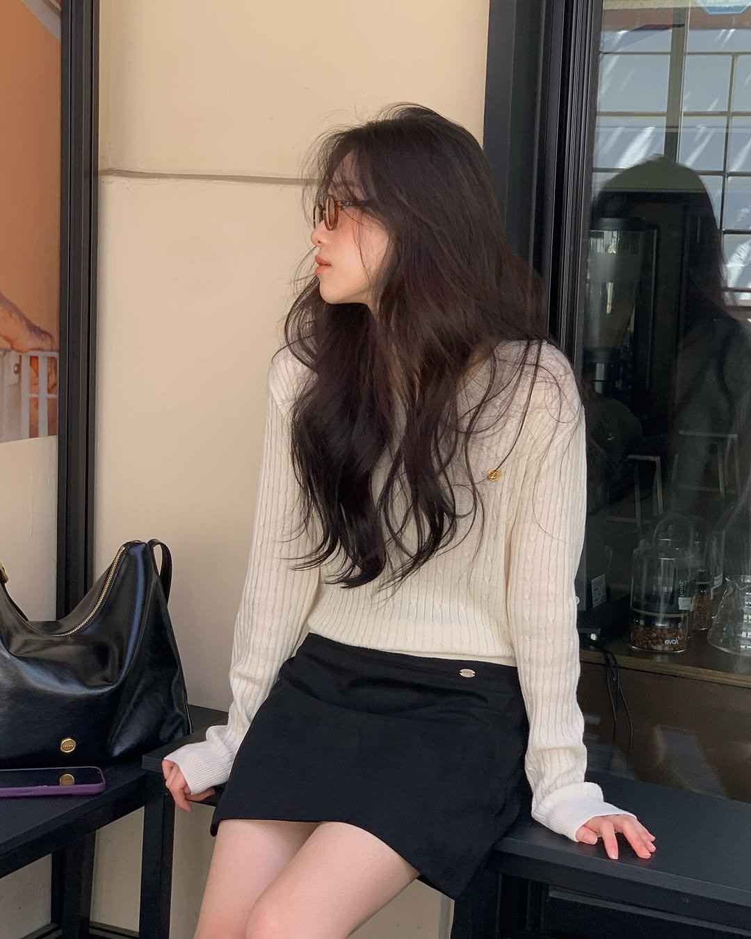Photo shared by 🪞윤경 | 패션모델 on September 13, 2025 tagging @rouet_official. May be an image of 1 person, hair, knit, skirt, miniskirt, turtleneck and text.
