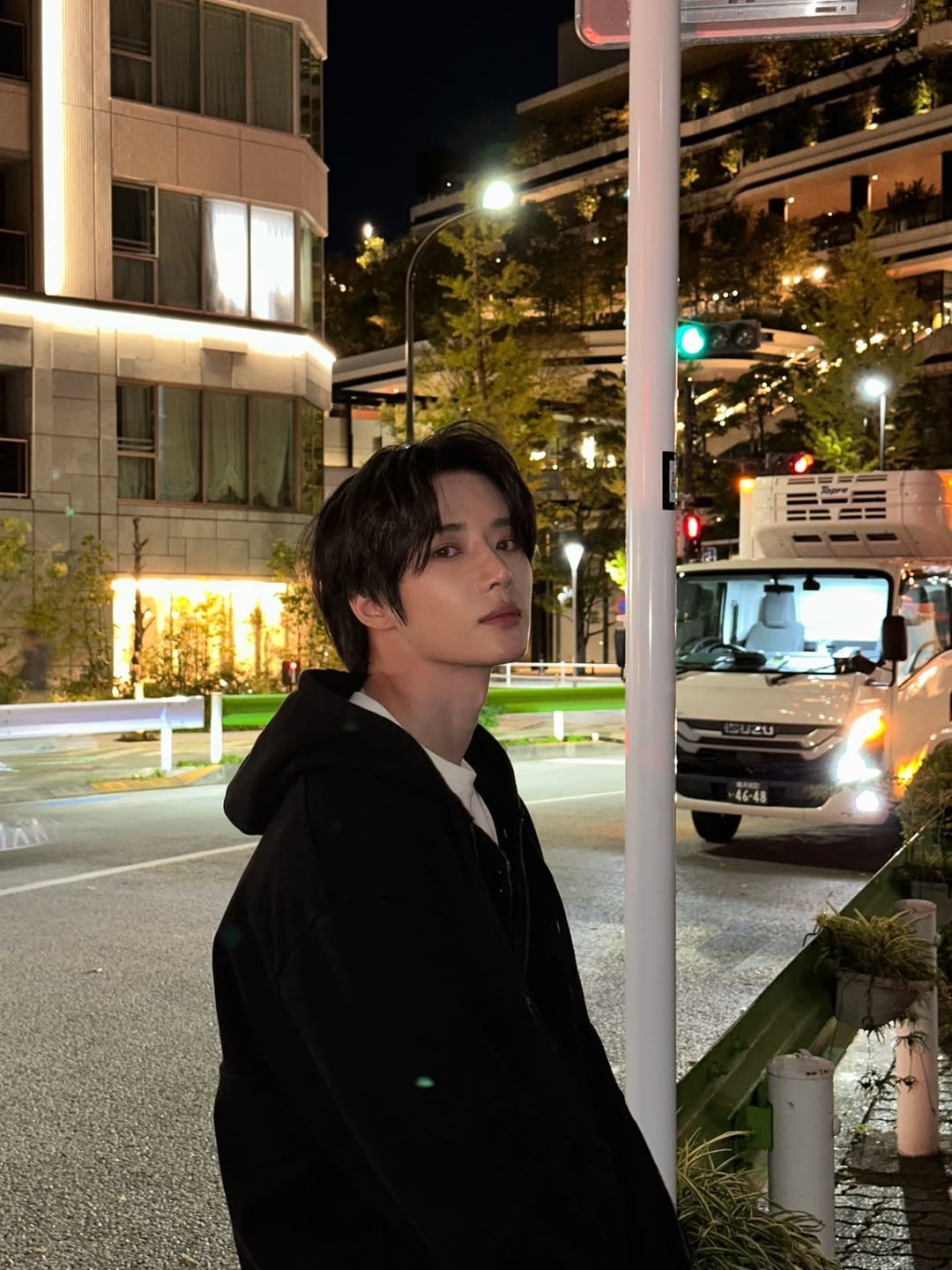 Photo by BEOMGYU of TXT on November 04, 2025. May be an image of duffle coat, night, outdoors and text.