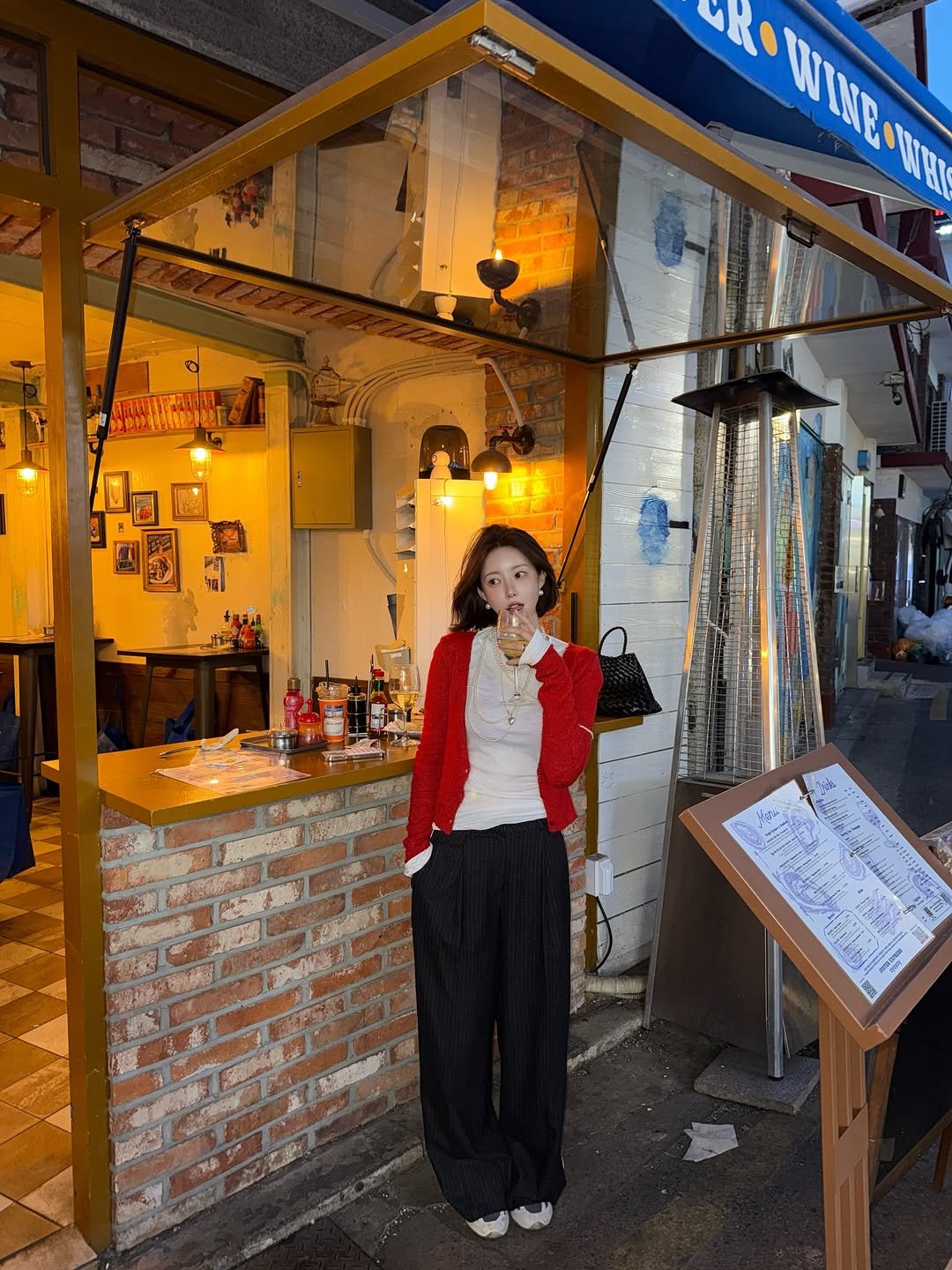 Photo by 반해찌 on April 02, 2026. May be an image of duffle coat, display case, street and text.