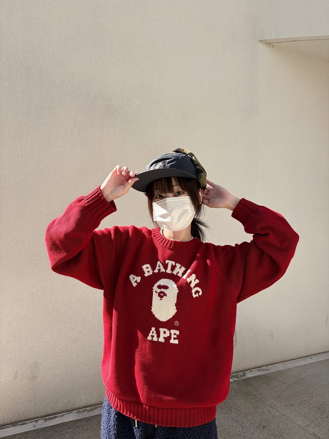 Photo shared by BAPE SEOUL on November 03, 2025 tagging @bapestorekorea, and @bape_seoul. May be an image of hat, parka, sweater, fleece, face mask, sweatshirt and text.
