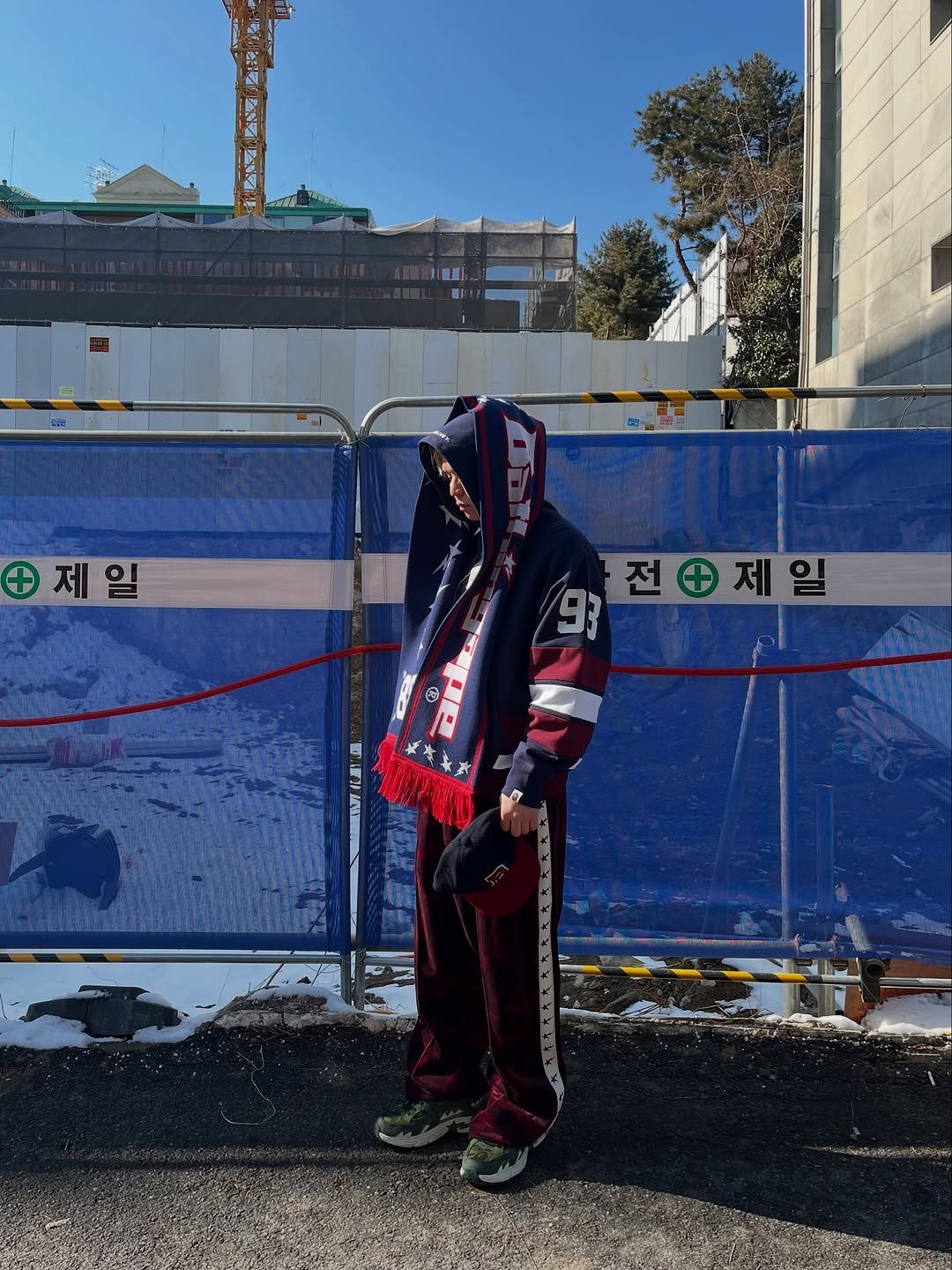 Photo shared by BAPE SEOUL on February 15, 2026 tagging @bapestorekorea, and @bape_seoul. May be an image of standing, face mask, sweatsuit, gas mask and text.