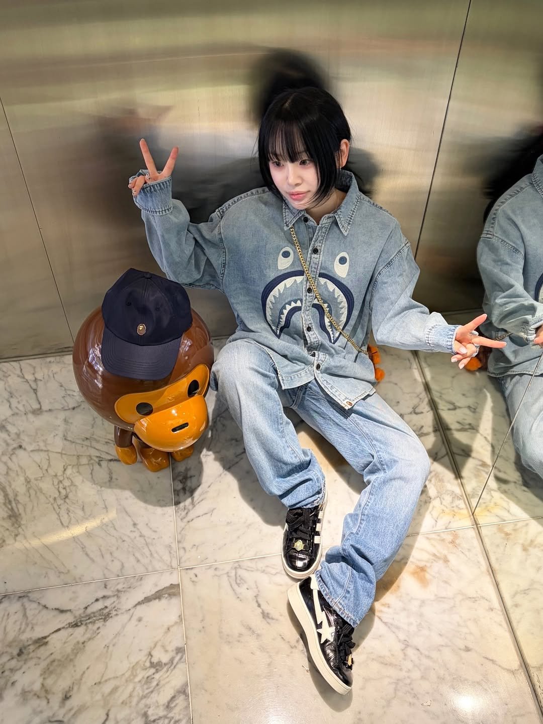 Photo shared by BAPE SEOUL on April 10, 2026 tagging @bapestorekorea, and @bape_seoul. May be an image of duffle coat, scarecrow and text.