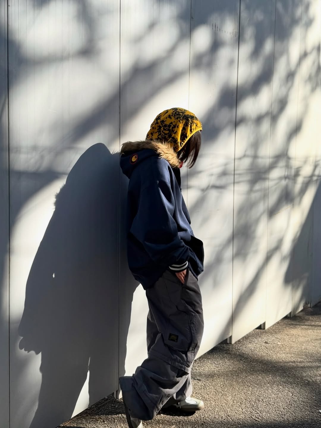 Photo shared by BAPE SEOUL on January 31, 2026 tagging @bapestorekorea, and @bape_seoul. May be an image of standing, duffle coat, face mask, sweatpants, sweatsuit, parka and text.