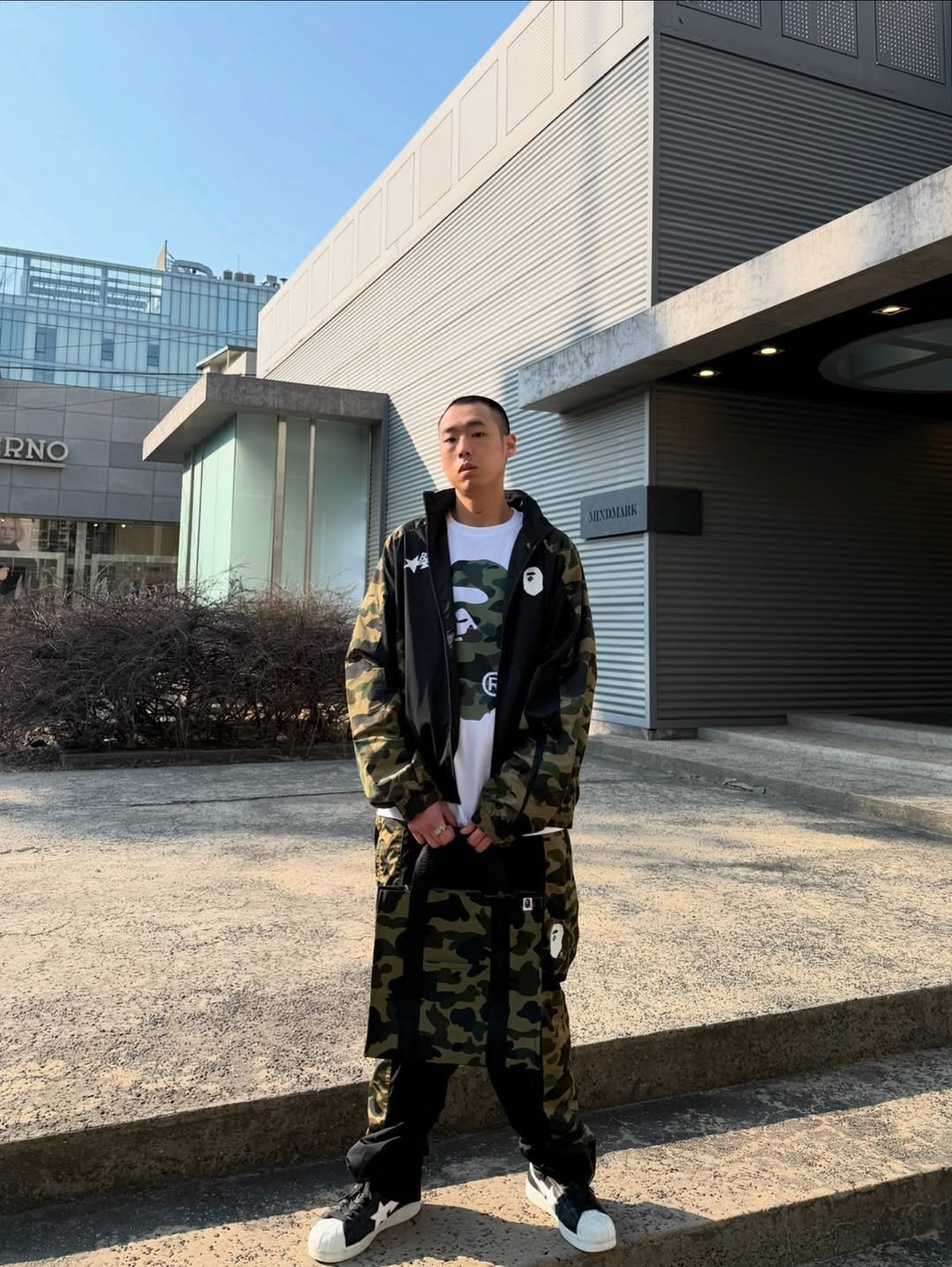 Photo shared by BAPE SEOUL on April 04, 2026 tagging @bapestorekorea, and @bape_seoul. May be an image of flight jacket, sweatpants, military uniform, parka and text.