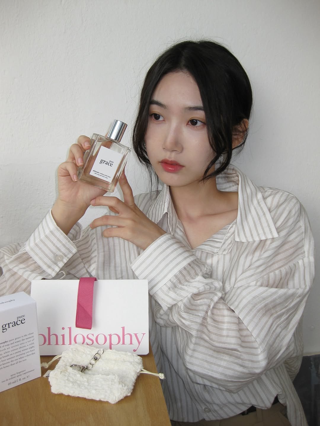 Photo shared by 김봄 | 프리랜서 배우&모델의 패션, 뷰티, vlog✨ on July 14, 2025 tagging @lovephilosophykr. May be an image of 1 person, makeup, fragrance, perfume, hand cream, white lily and text.
