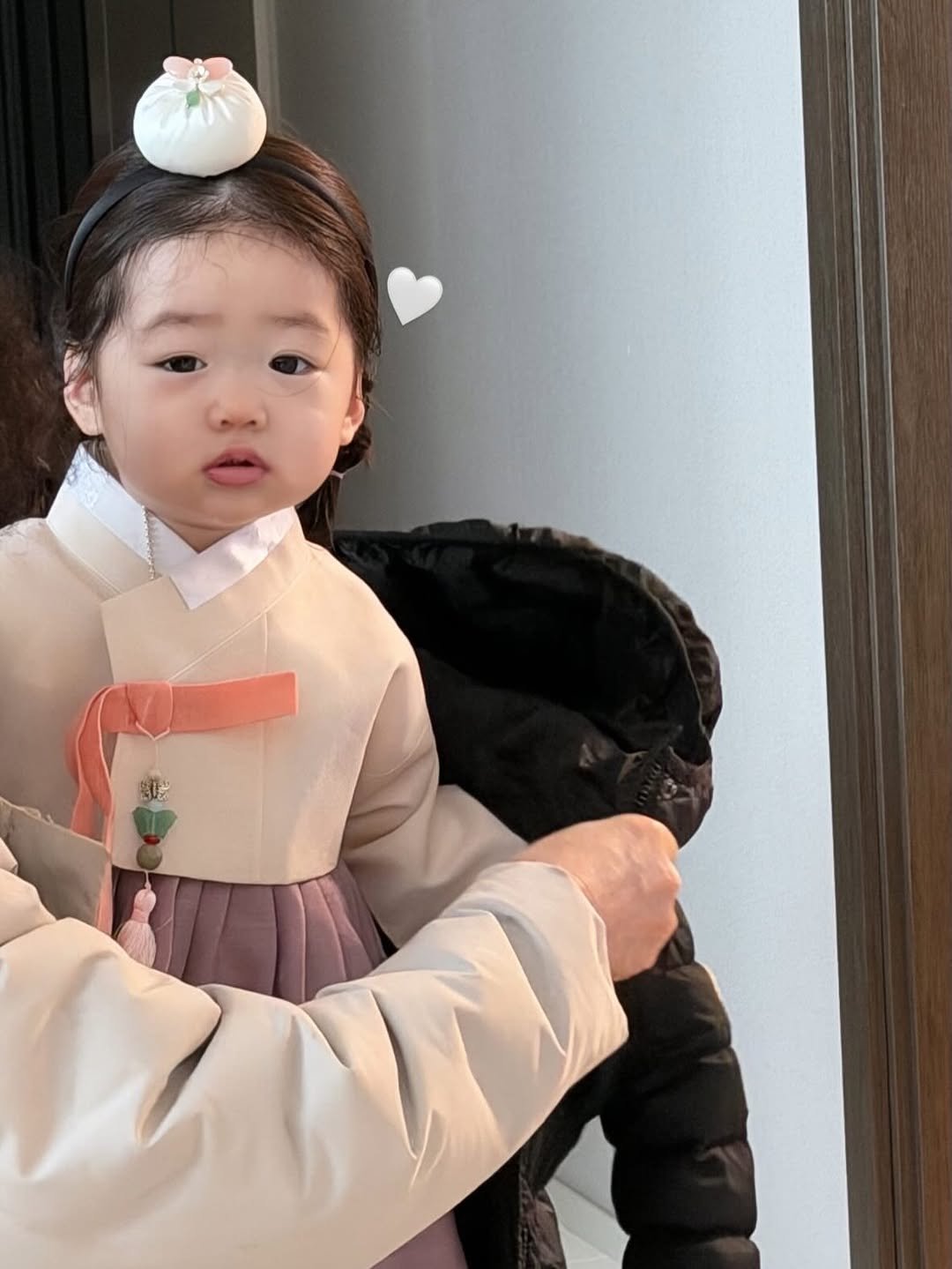 Photo shared by 민스샵 ㅣ 미인채 대표  천정민 on February 11, 2026 tagging @bbomool418. May be an image of baby, duffle coat and text.