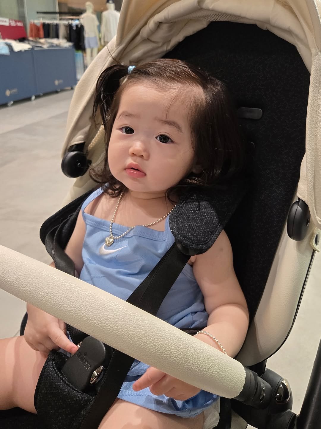Photo by 김아인 (뽀물이 👶🏻) on July 27, 2025. May be an image of 1 person, baby, sling, shopping cart, buggy and text.