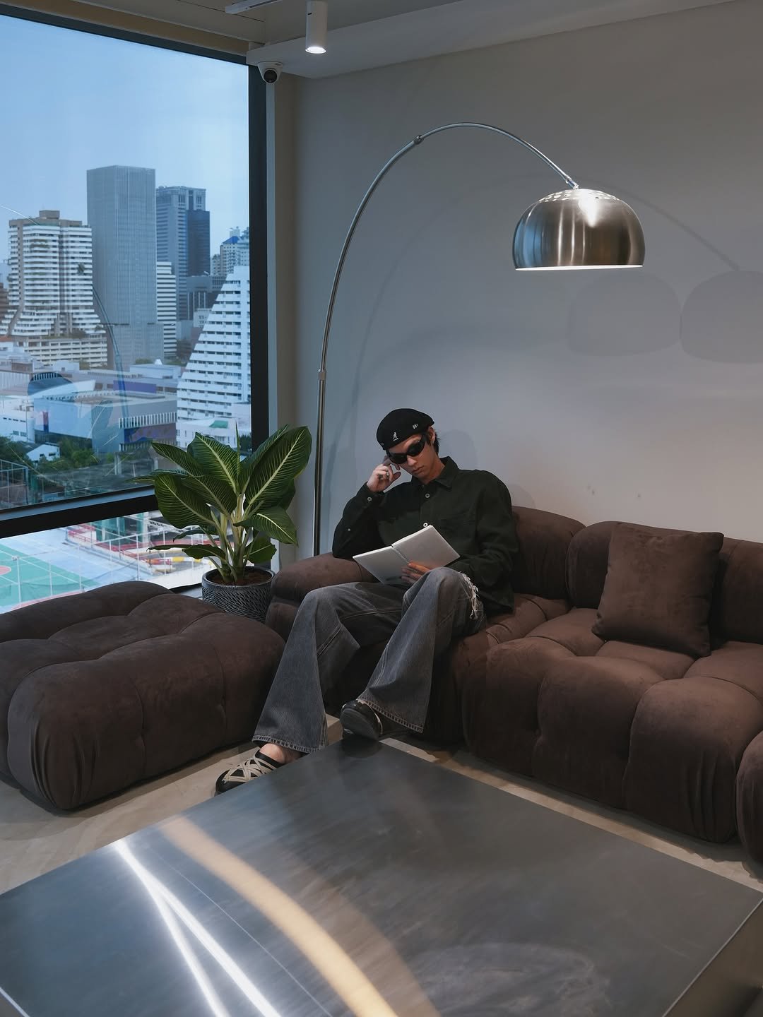 Photo by BRIGHT on August 18, 2025. May be an image of 1 person, lighting, armchair, sofa, chaise lounge, futon, living room, indoors and text.