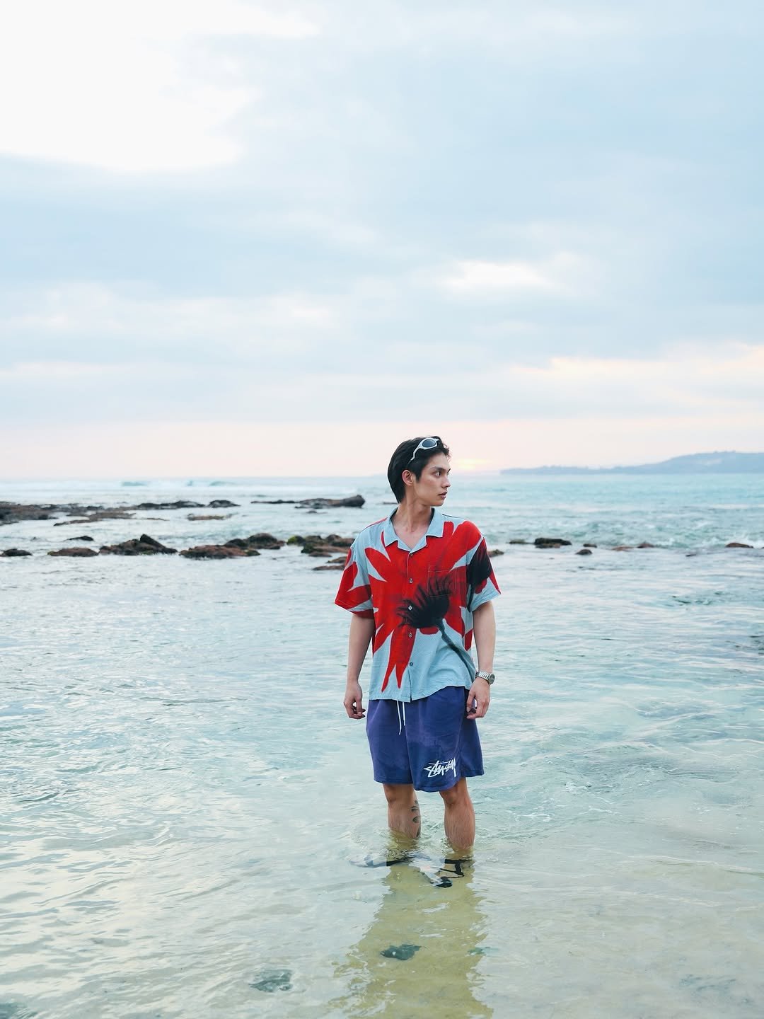 Photo by BRIGHT on August 29, 2025. May be an image of 1 person, shorts, sarong, ocean, beach and text.