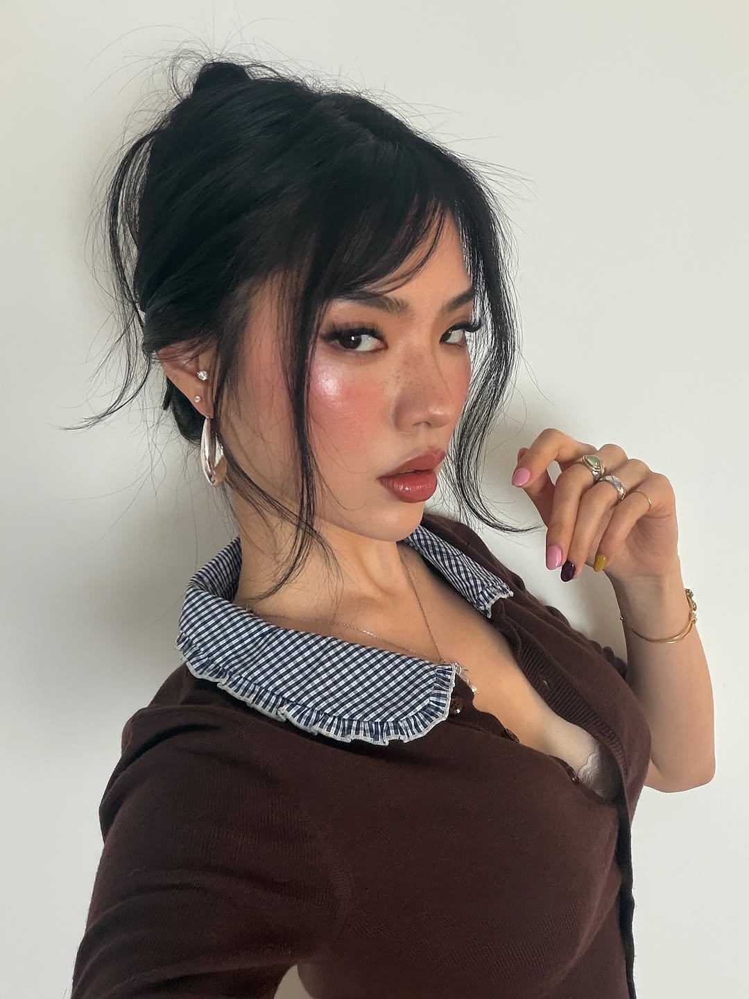 Photo by Amberly Yang on March 16, 2026. May be a selfie of one or more people, makeup, eyeliner, hair, lipstick, turtleneck and text.